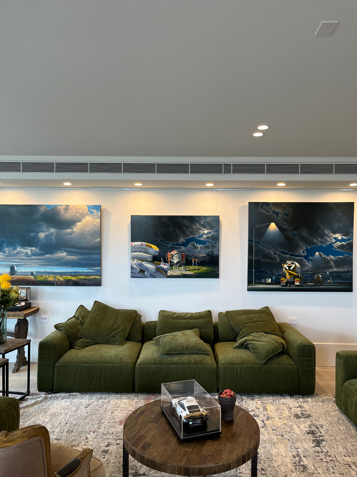 Living room with rail system holding large artworks
